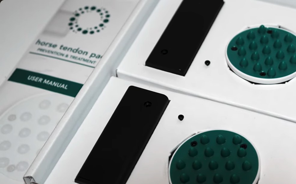 Two Horse Tendon Pads in their box with the user manual
